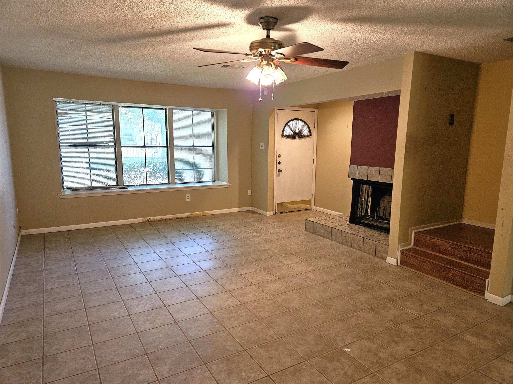 Image 3: Living Room with fireplace.