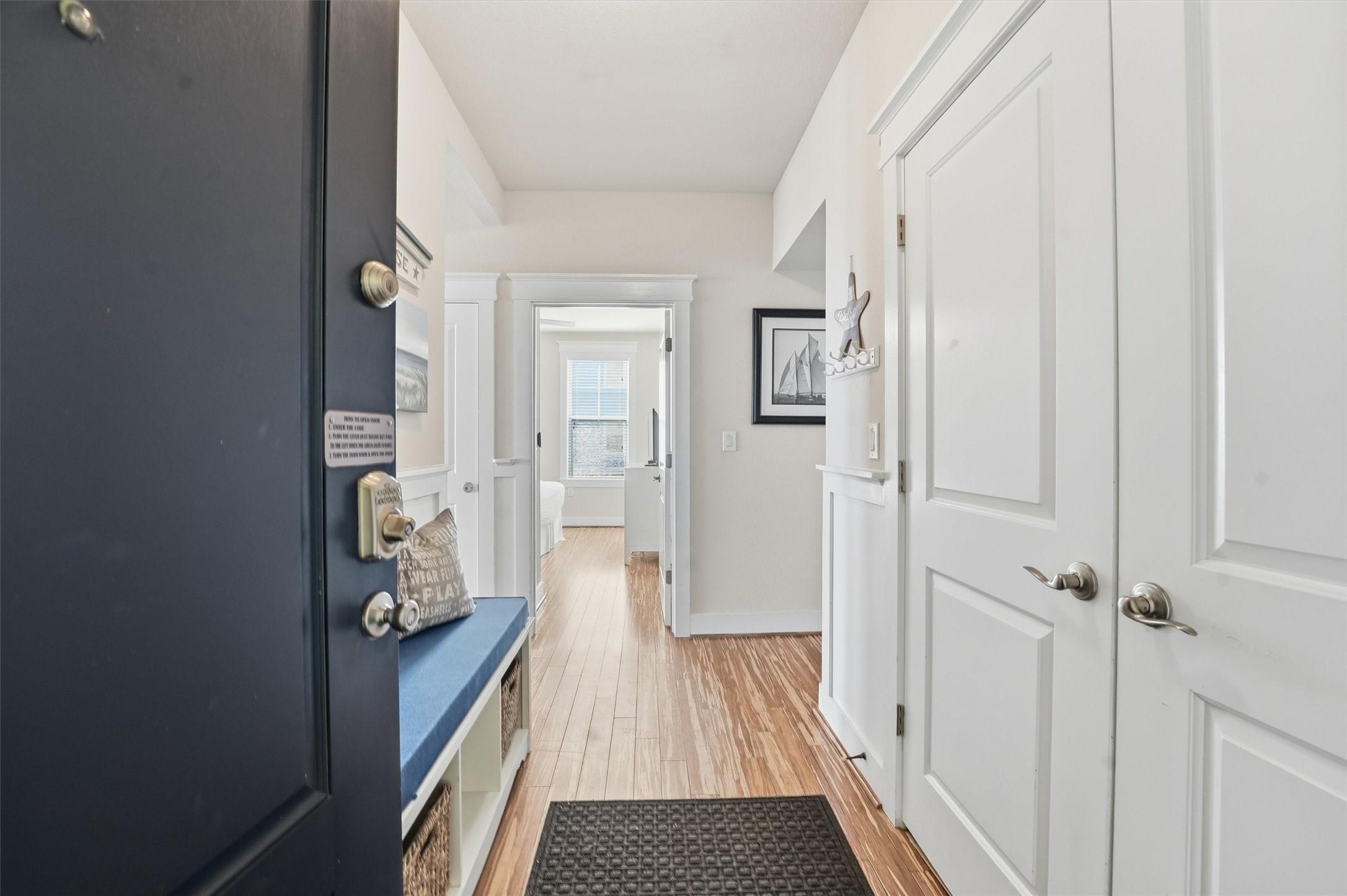 Image 3: Step inside to a bright, welcoming foyer featuring