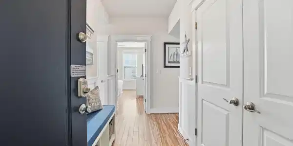 Image 3: Step inside to a bright, welcoming foyer featuring