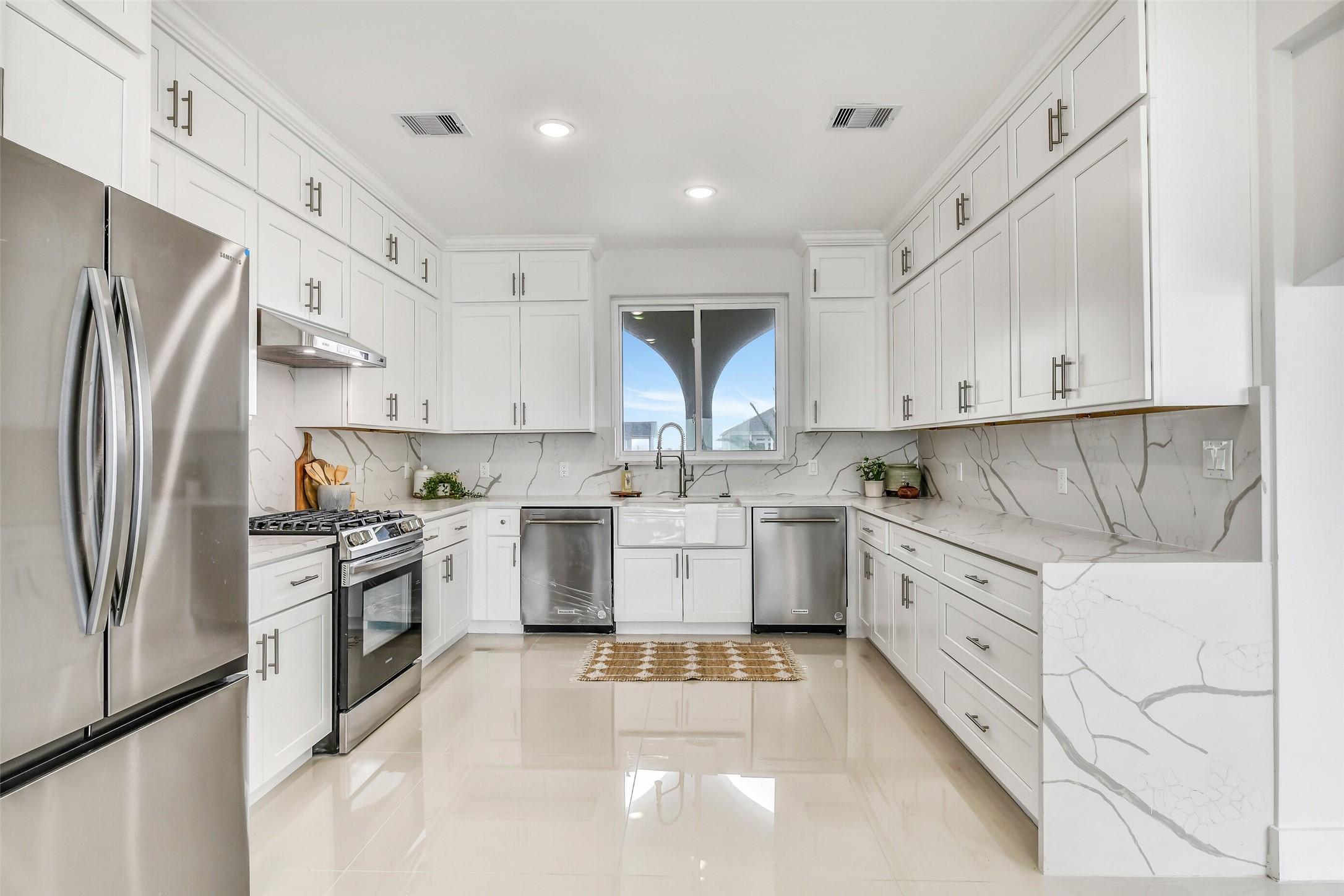 Image 3: This kitchen blends luxury and performance beauti