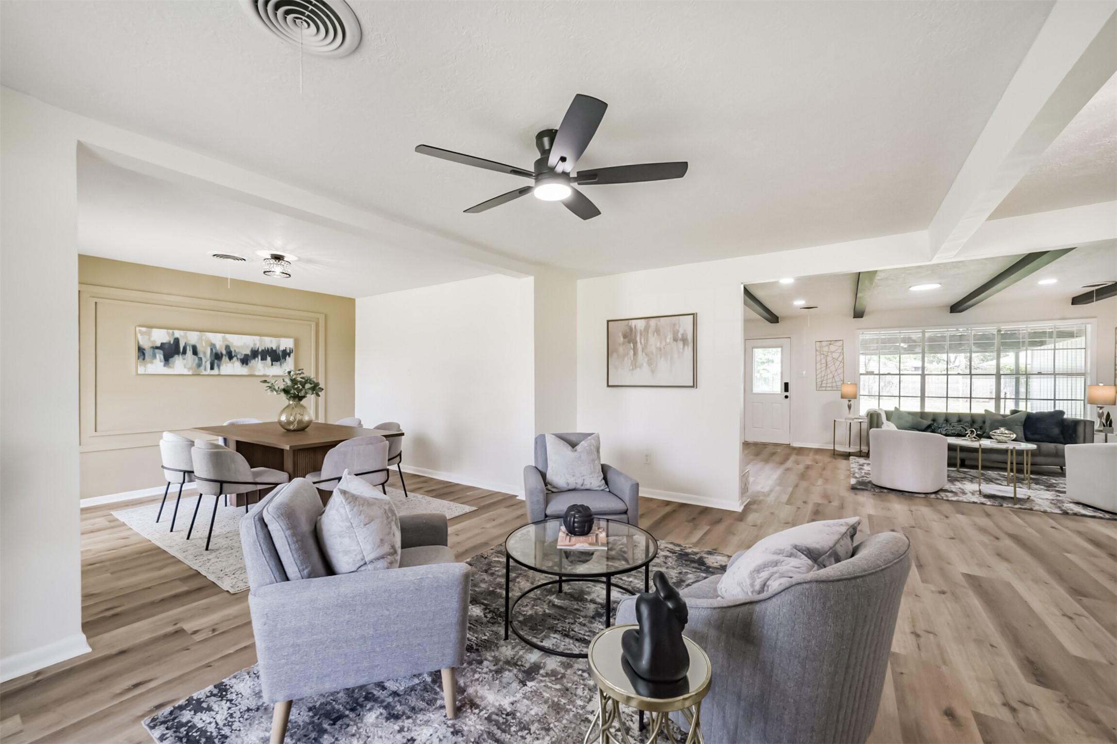 Image 3: dining room open to living room previously staged