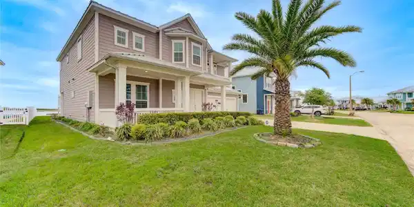 Image 2: Stately two-story home with a welcoming front porc