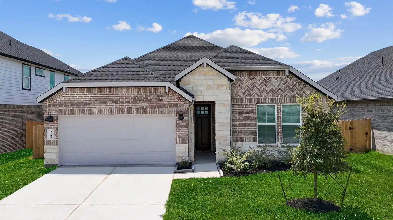 Image 1: Newly built single story home with traditional arc