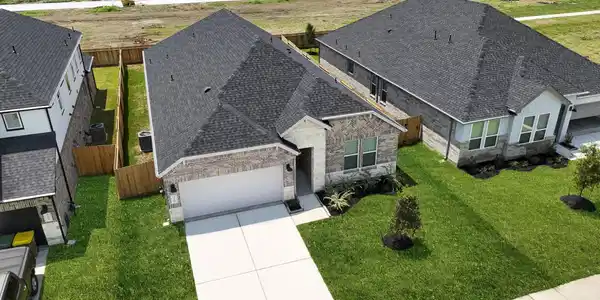 Image 2: An aerial view of the newly built one story home w