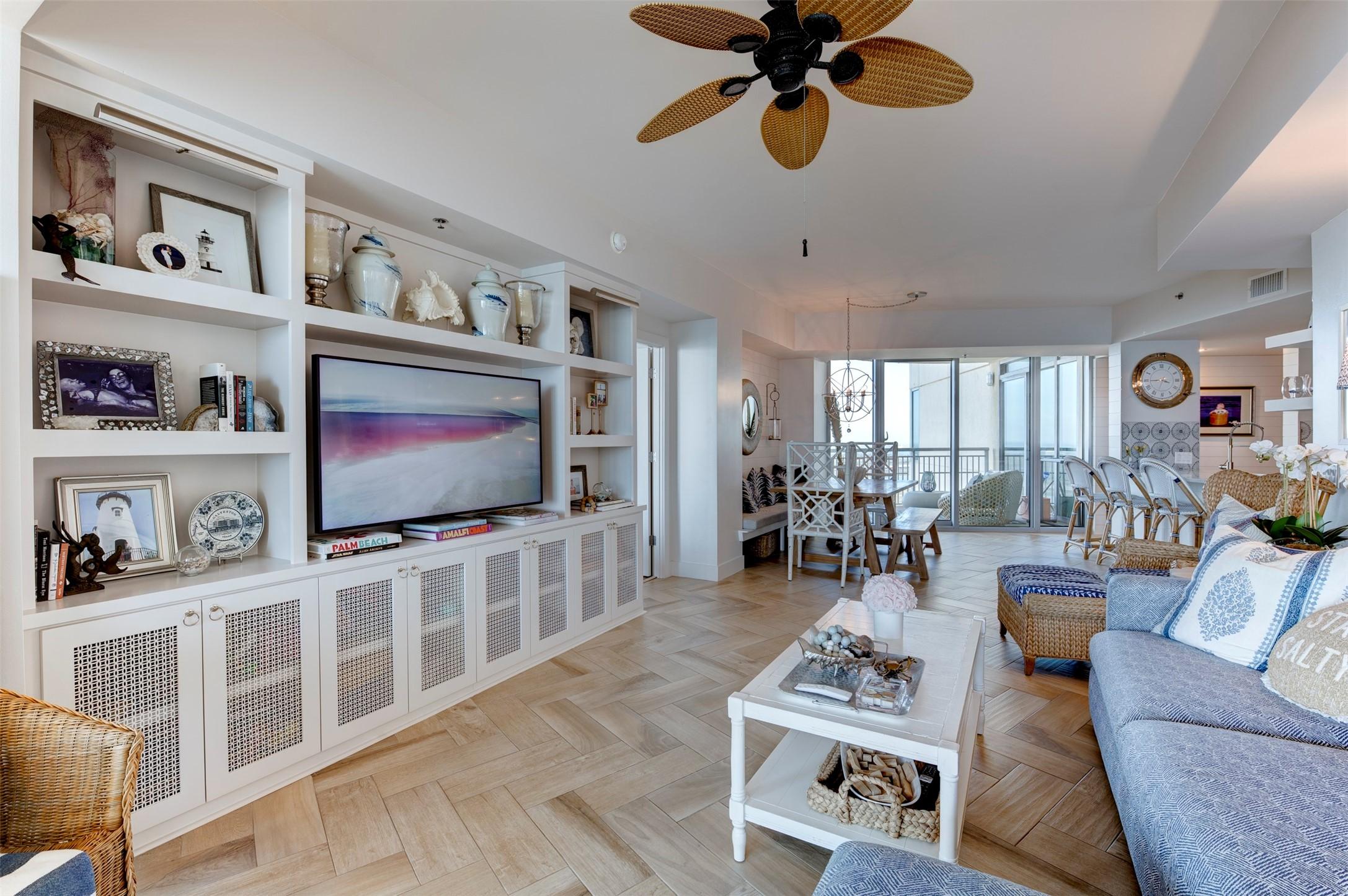 Image 1: A striking wall of custom built-ins in the living