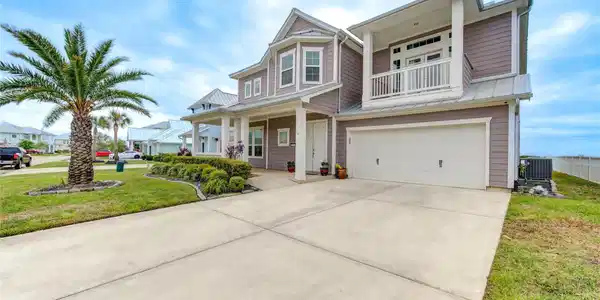 Image 3: Generous double wide driveway and beautiful landsc