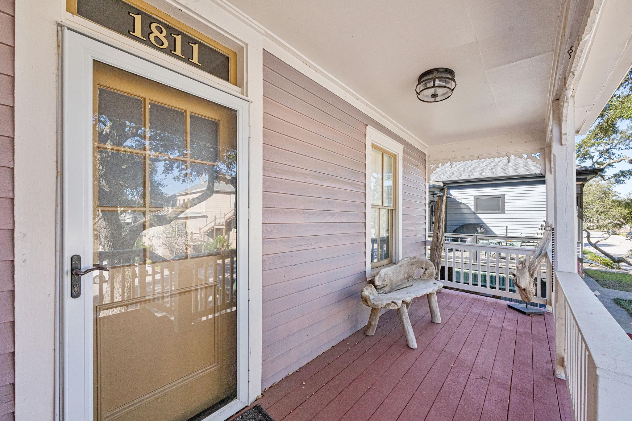 Image 4: Charming front porch with character, featuring a w