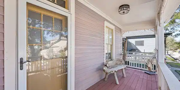 Image 4: Charming front porch with character, featuring a w