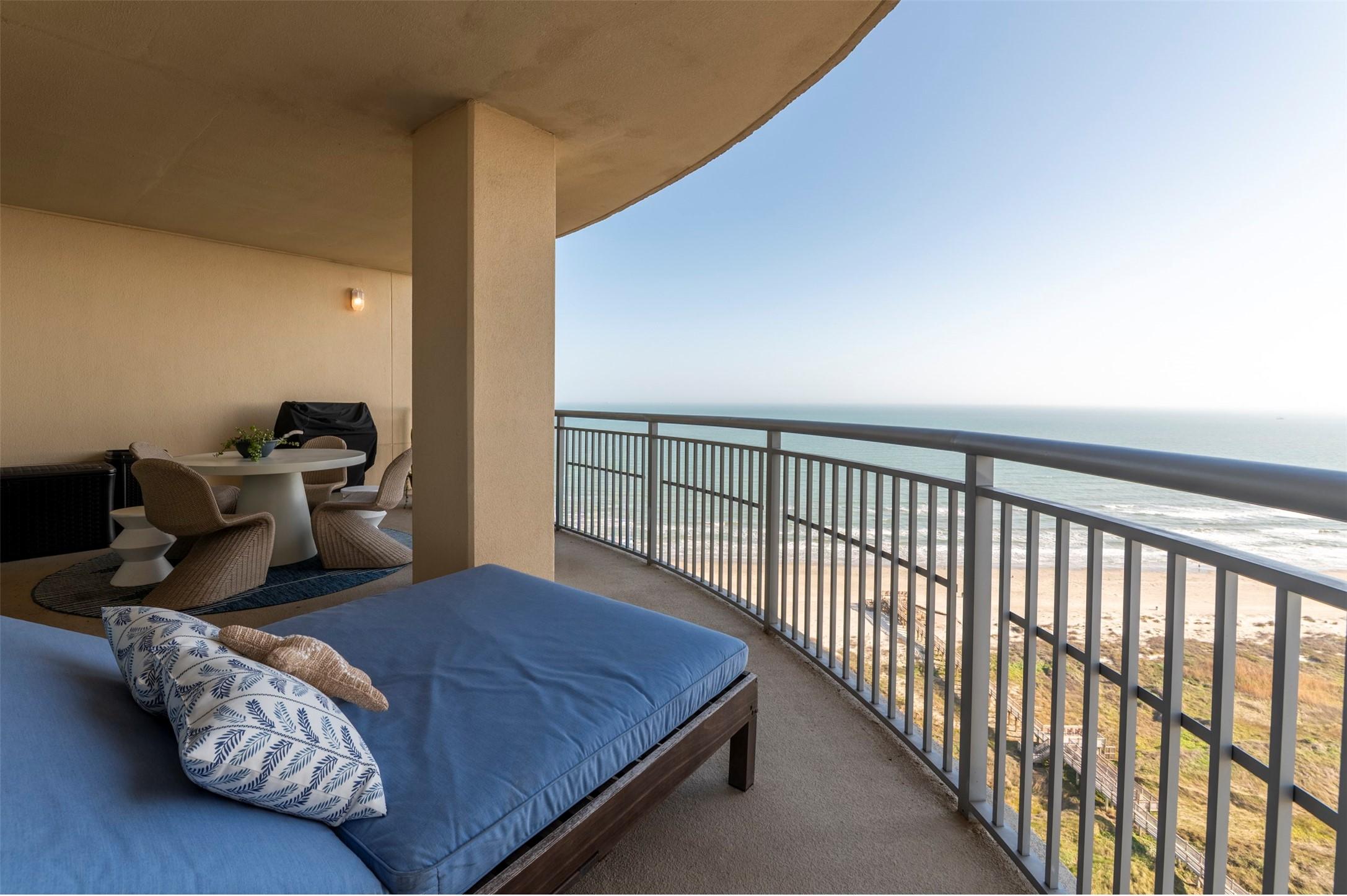 Image 3: The beachfront balcony offers plenty of space for