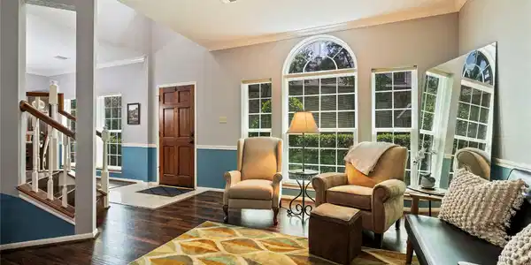 Image 3: A view of the front entrance and formal living roo