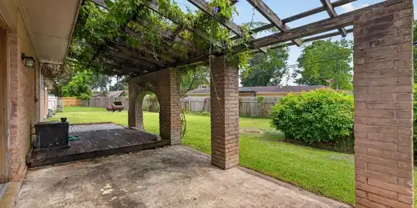 Image 4: Arbor In Back Yard Provides A Comfortable Sitting