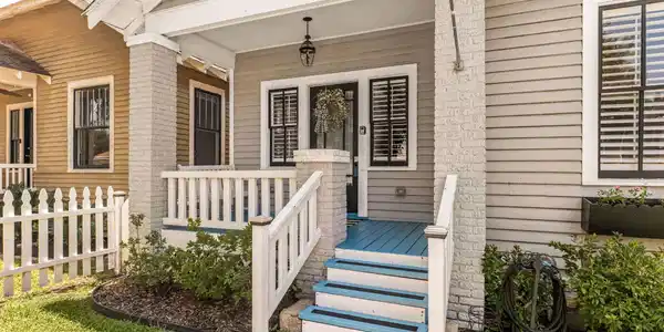 Image 3: Step onto the inviting front porch, complete with