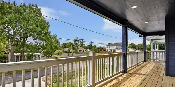 Image 2: Spacious covered balcony with wooden flooring offe