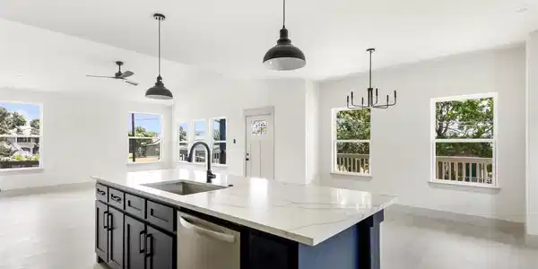 Image 4: Bright, open-concept living area featuring a moder