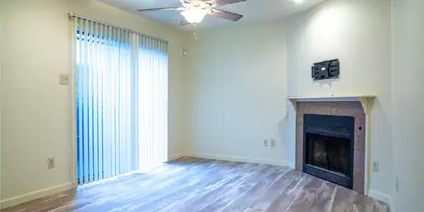 Image 3: Cozy living room featuring a ceiling fan, fireplac