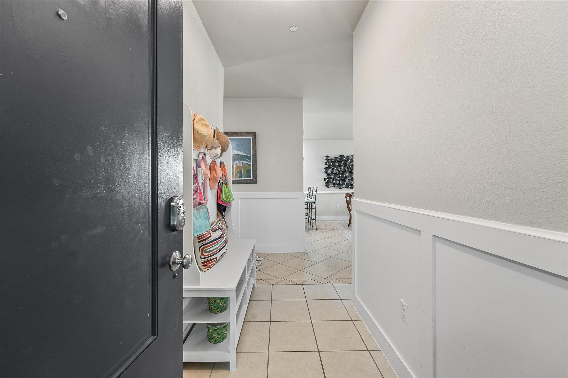Image 2: Step inside through a bright entryway that sets th