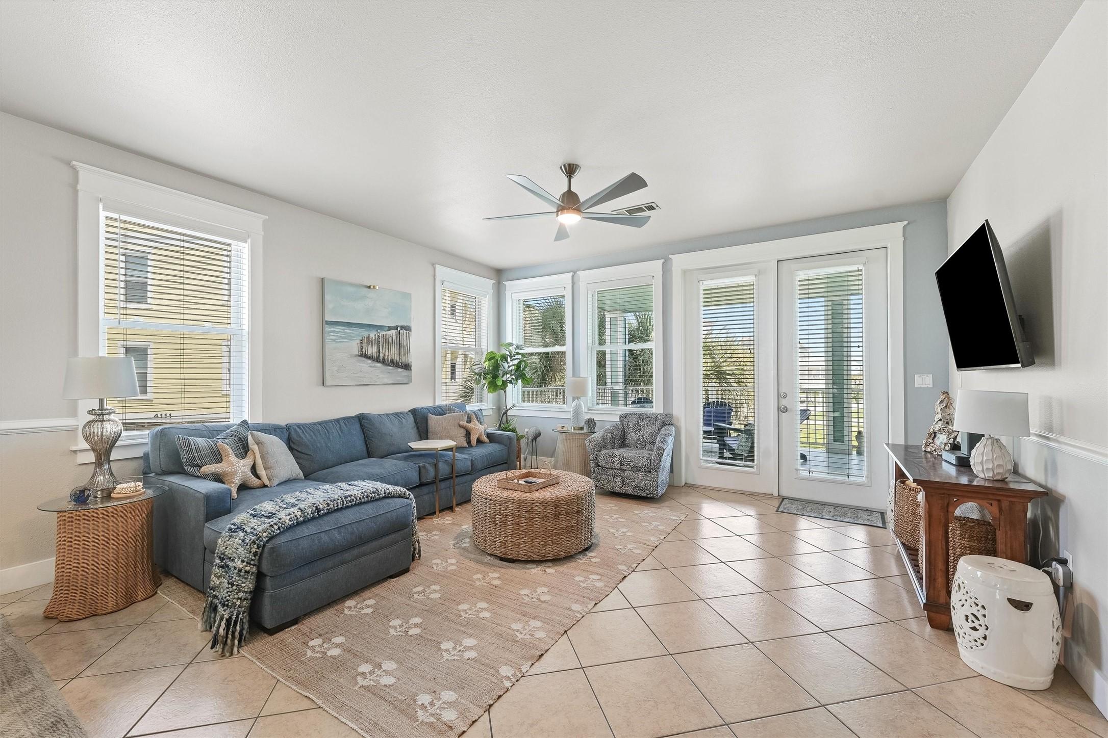 Image 3: The main living space is filled with natural light