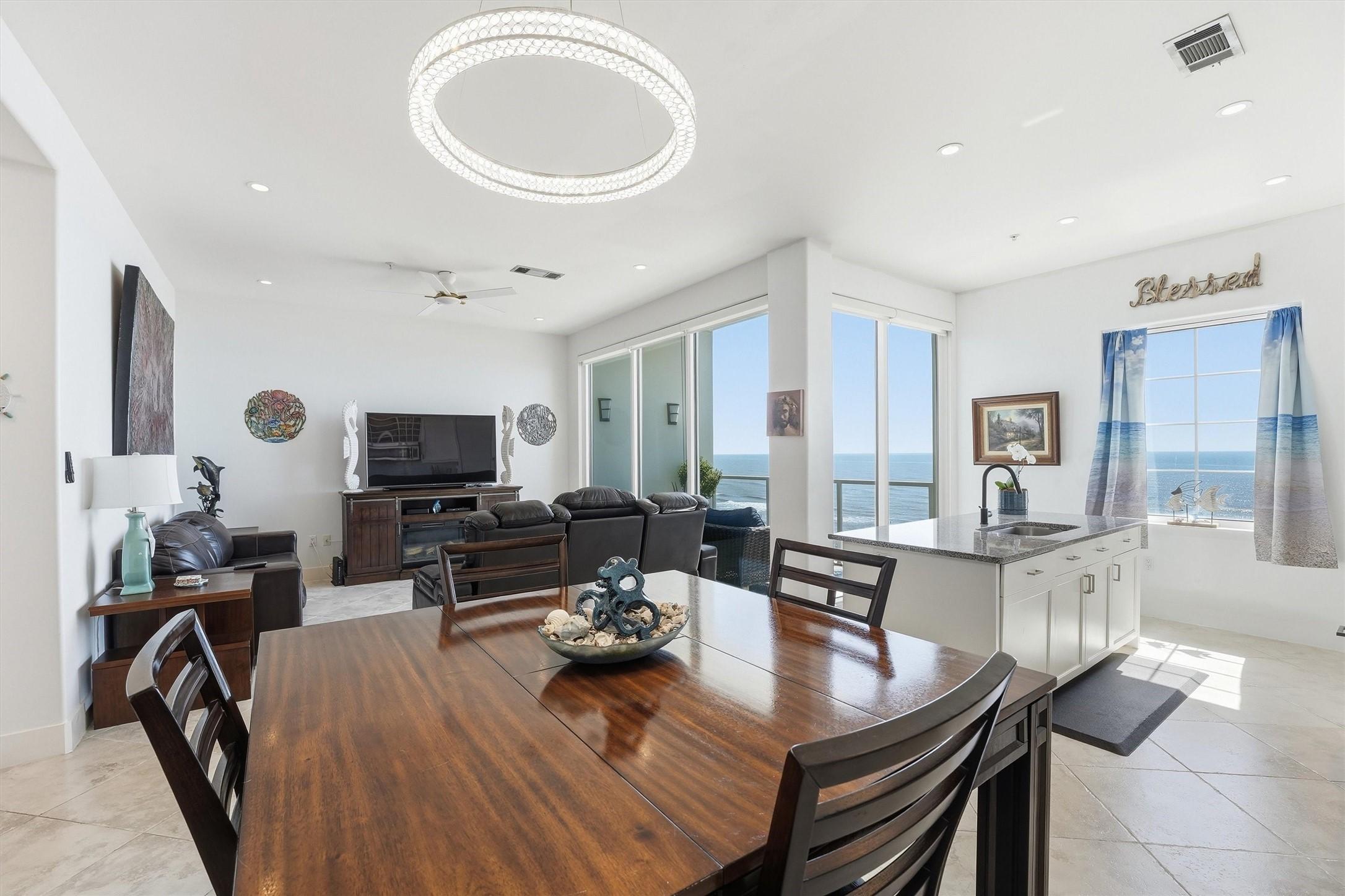 Image 3: Nice open layout with a dedicated dining area.