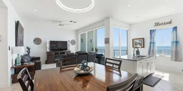 Image 3: Nice open layout with a dedicated dining area.