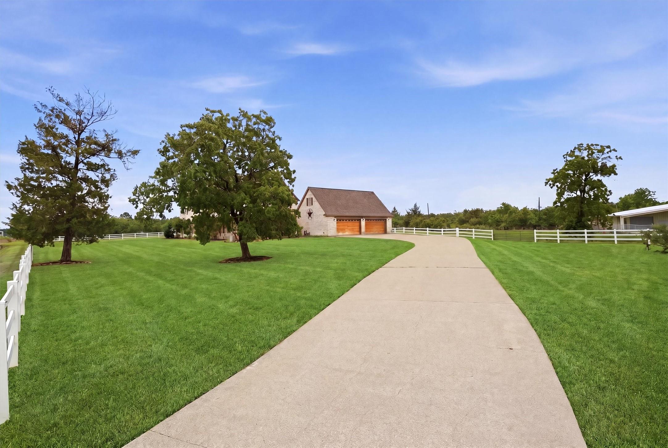 Image 2: Grand private driveway leading to the home
