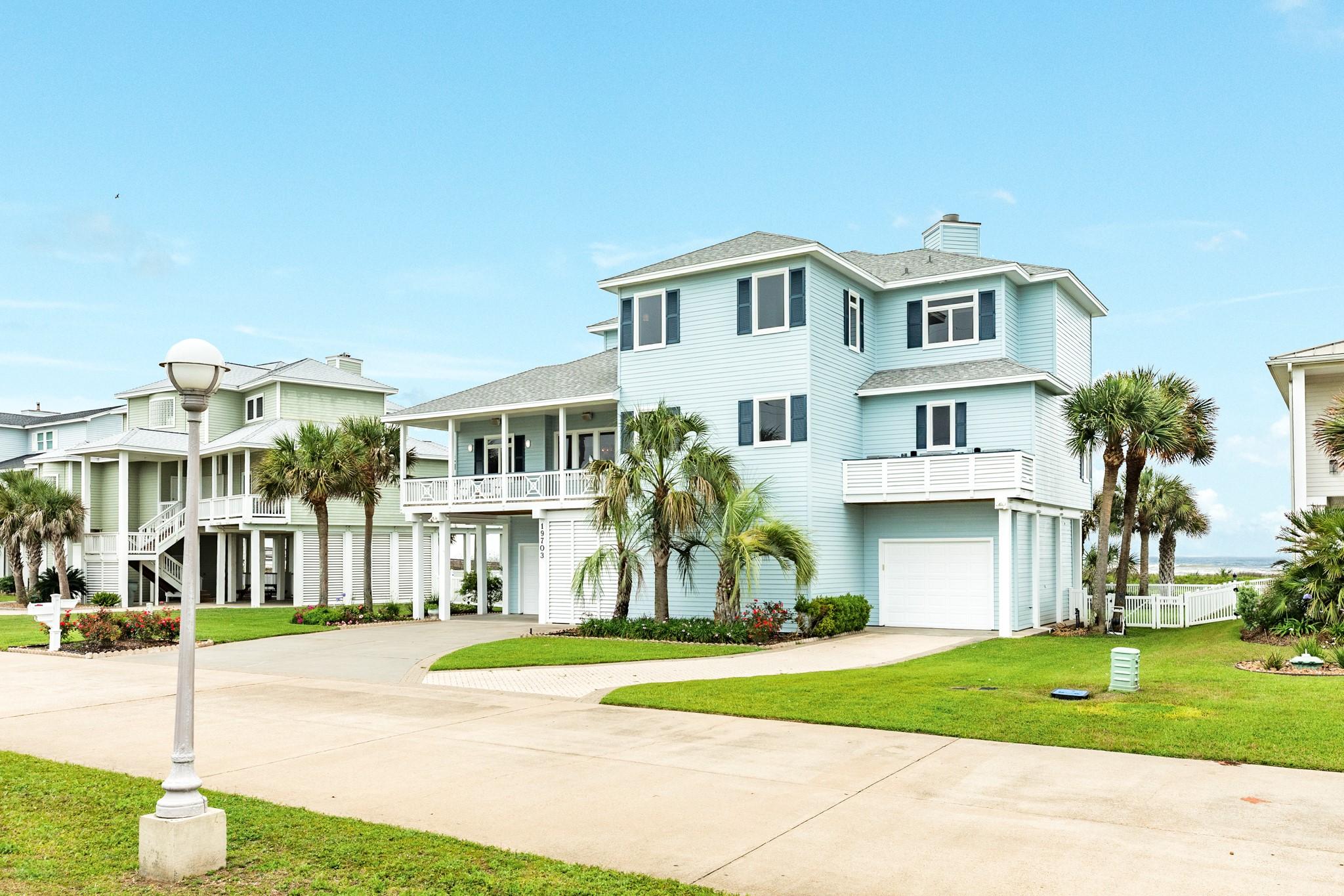 Image 2: Street view of beachfront living.