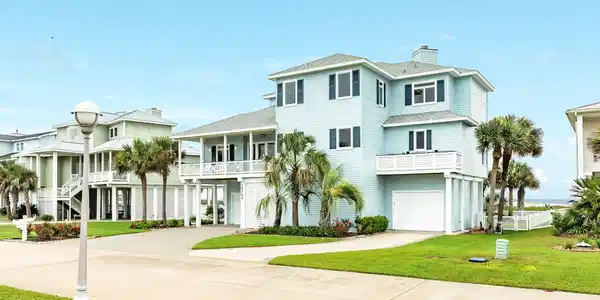 Image 2: Street view of beachfront living.