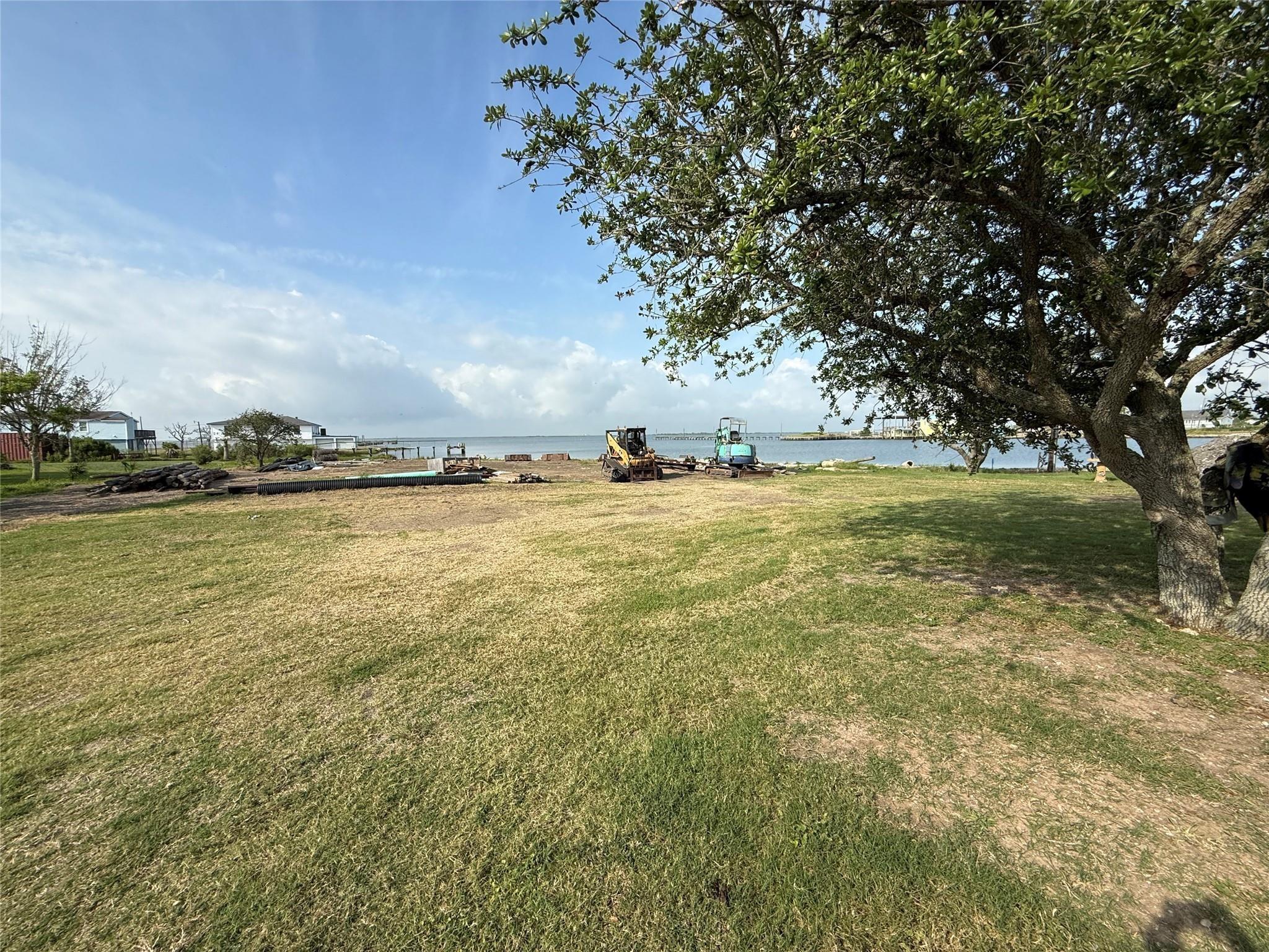 Image 4: there is a small piece of land between the propert