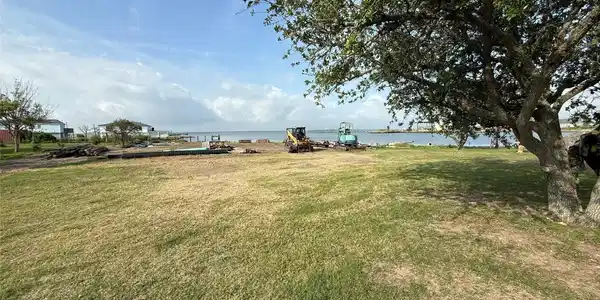 Image 4: there is a small piece of land between the propert