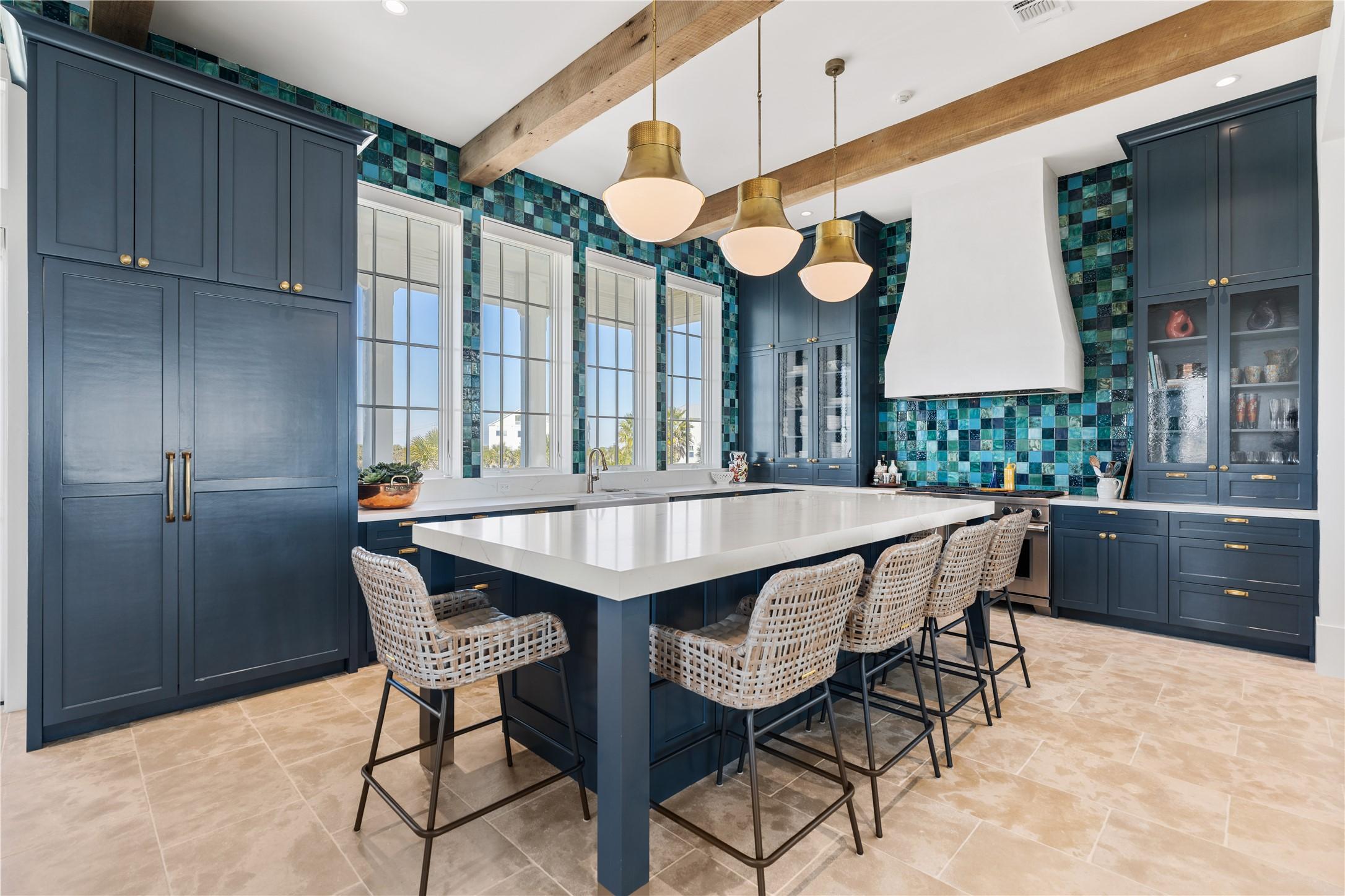 Image 2: This modern kitchen features elegant custom cabine