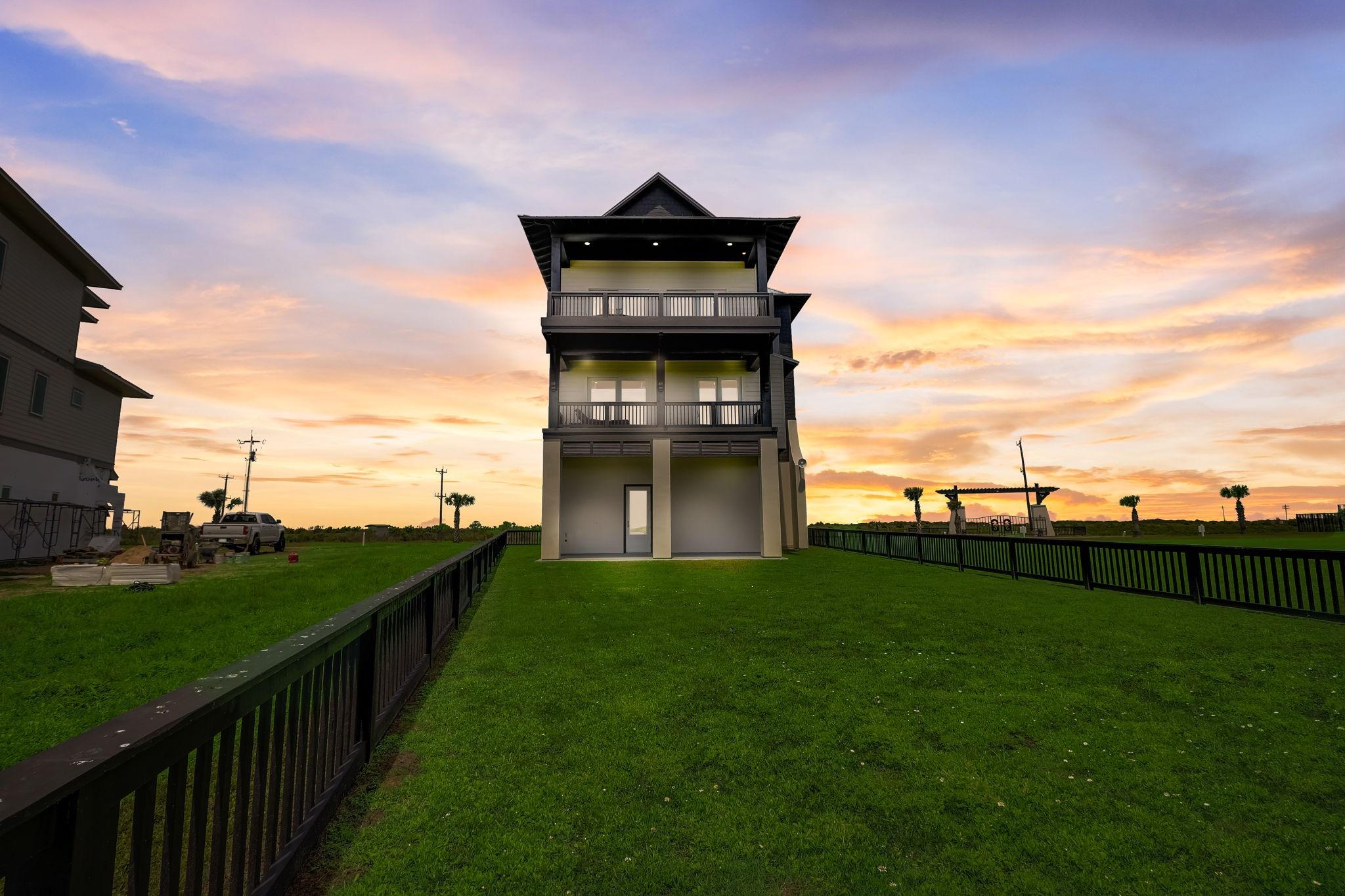 Image 2: Beautiful sunset view highlighting the home&rsquo;s stri