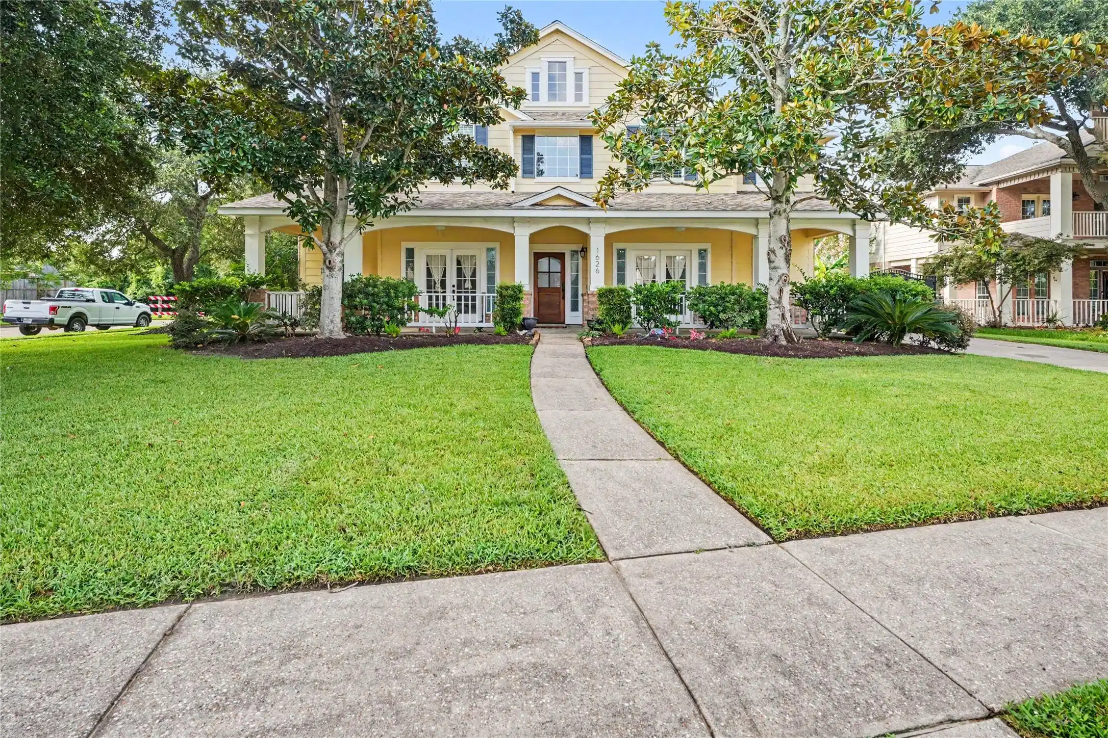 Image 1: Charming two-story home with a welcoming front por