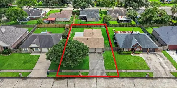 Image 3: Aerial view showing the home's lot boundaries and
