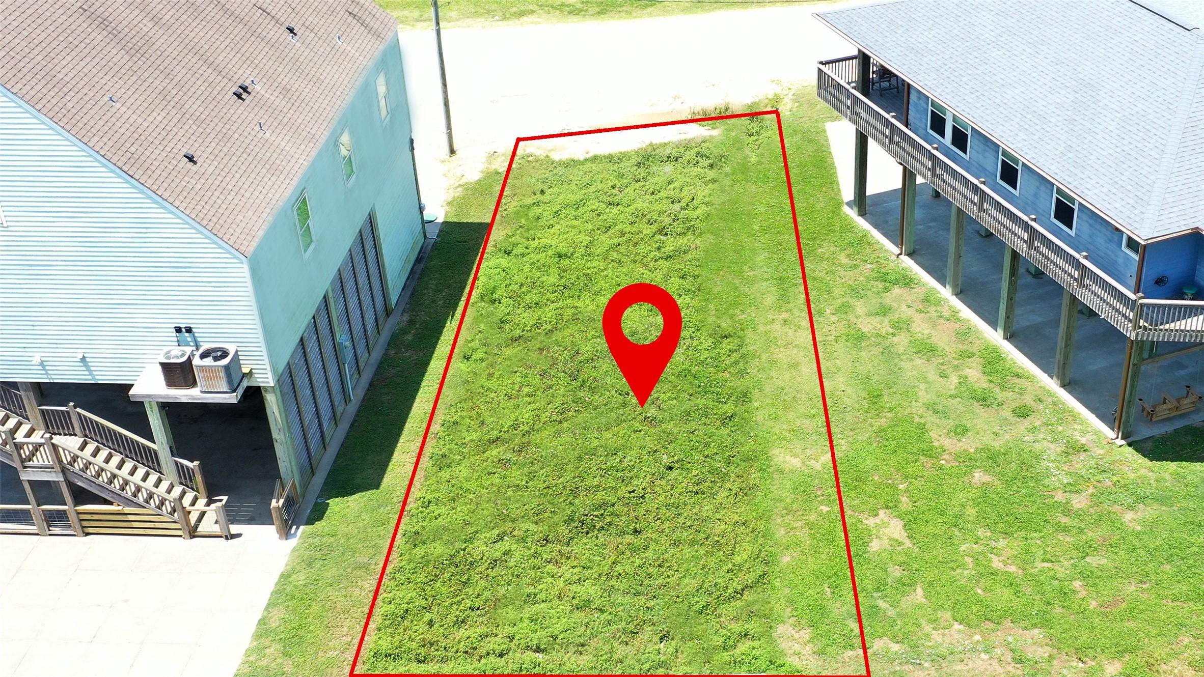 Image 4: This photo shows a vacant lot outlined in red, sit