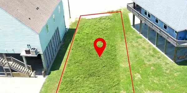 Image 4: This photo shows a vacant lot outlined in red, sit