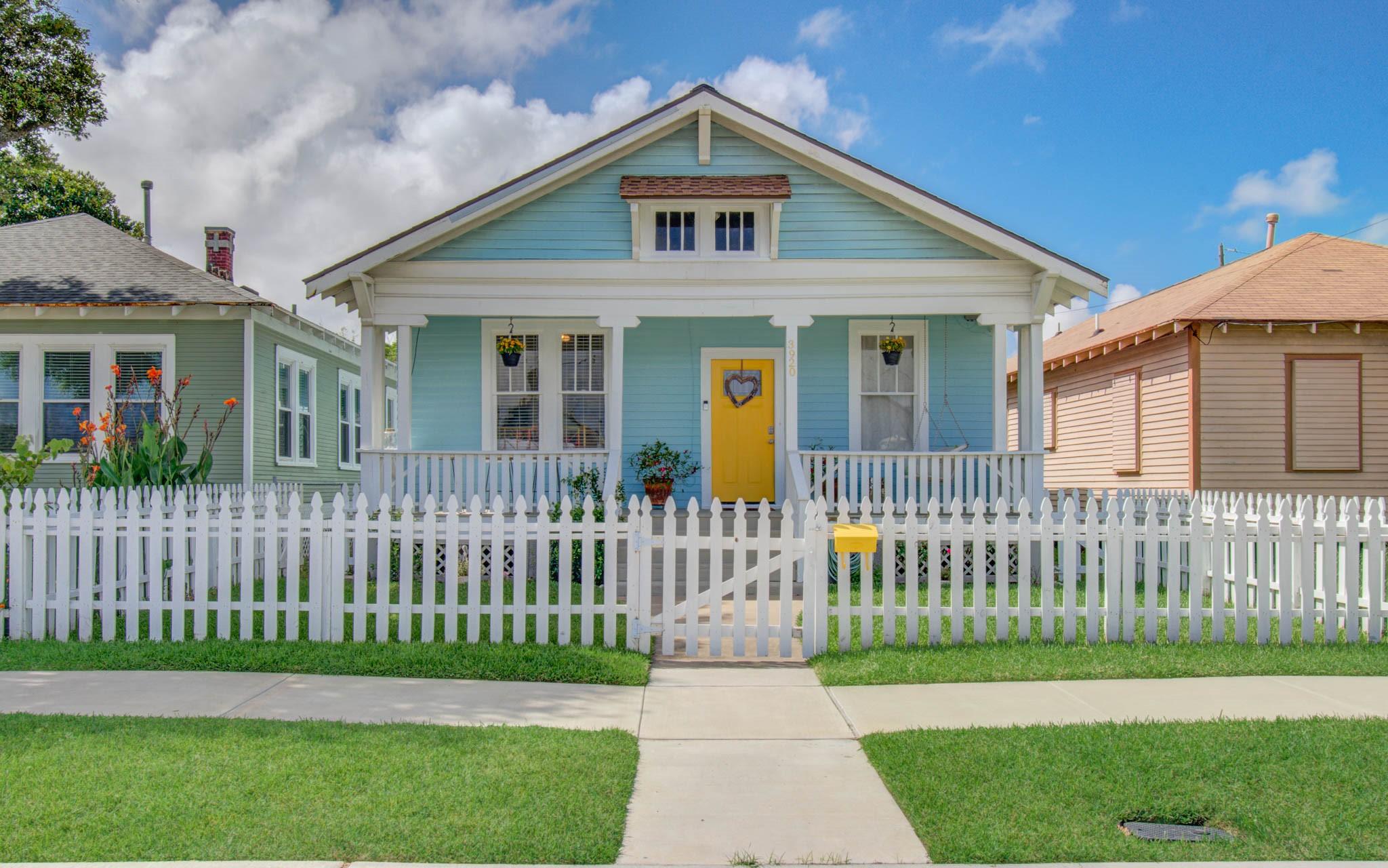 Image 2: Features a classic white picket fence, well-mainta
