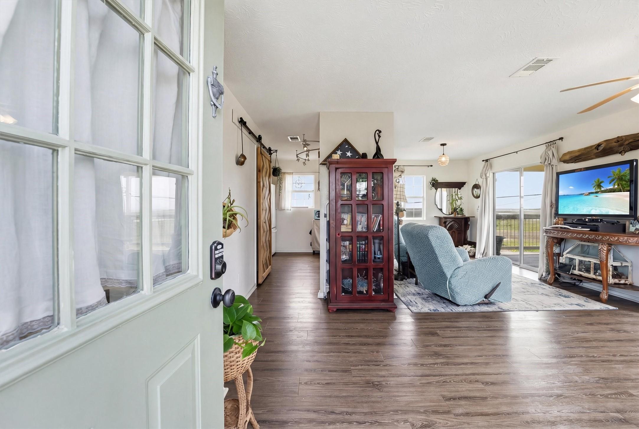 Image 4: Welcoming living area with abundant natural light.