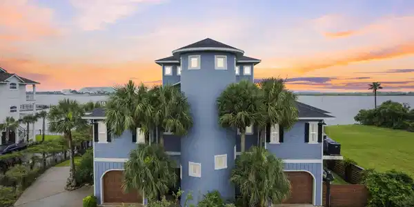 Image 4: This luxury home offers exceptional curb appeal wi