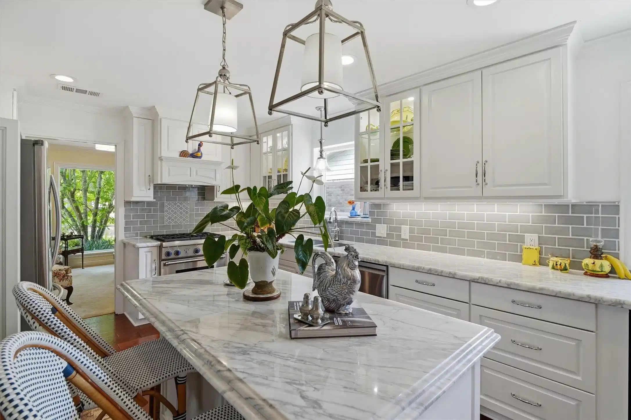 Image 1: Carrera marble countertops, handcrafted cabinetry,