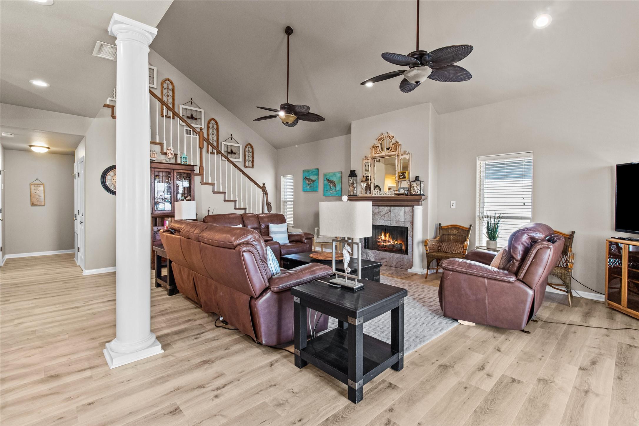 Image 3: Spacious living room with high ceilings, featuring