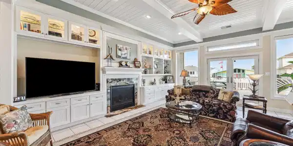 Image 2: The beautiful custom cabinetry in the living room