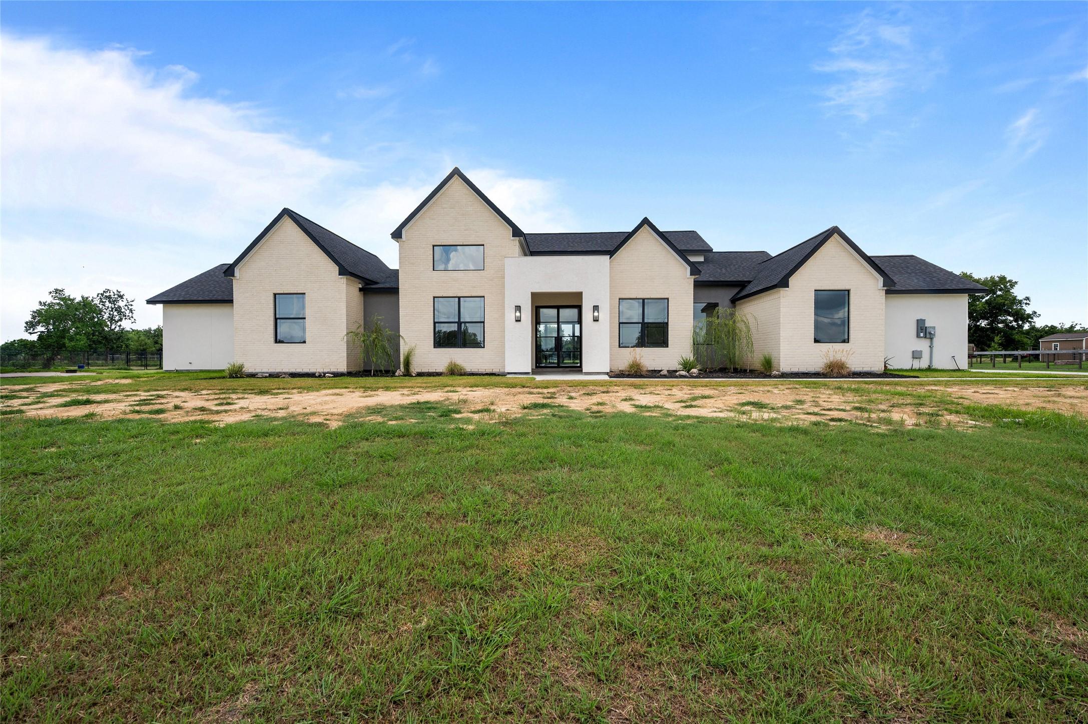 Image 1: Gorgeous home with multiple finishes on the front.