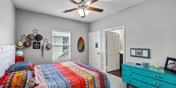 Image 3: The primary bedroom provides a comfortable retreat
