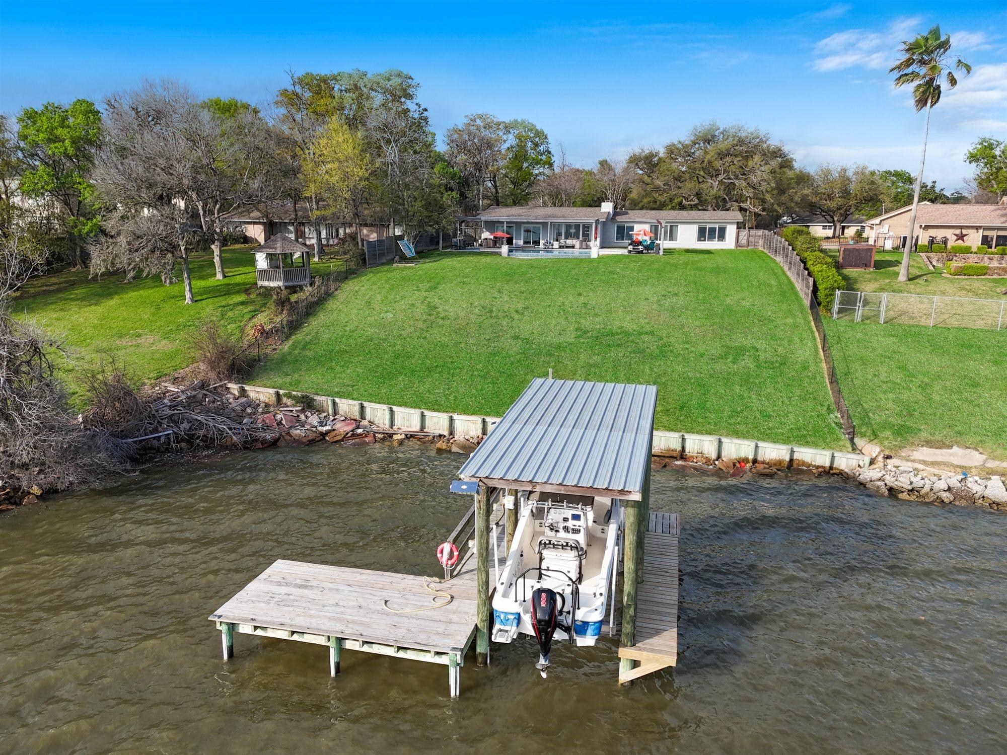 Image 4: BOATHOUSE with pier and waterside deck.  Pull up a
