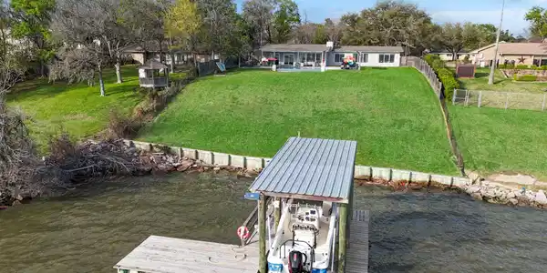 Image 4: BOATHOUSE with pier and waterside deck.  Pull up a