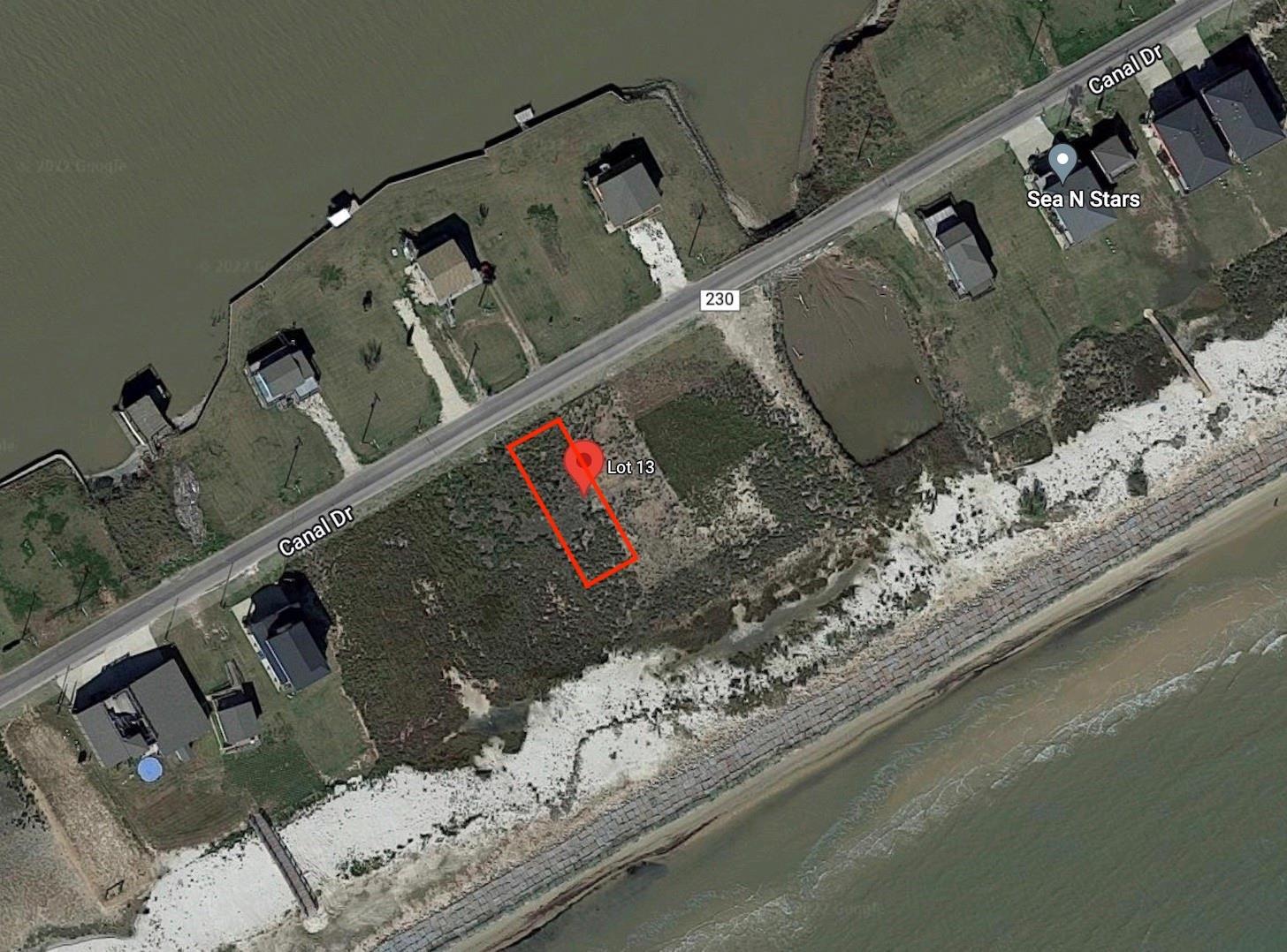 Image 2: 1064 Canal Dr. CR 230, is a 50'x160' vacant lot wi