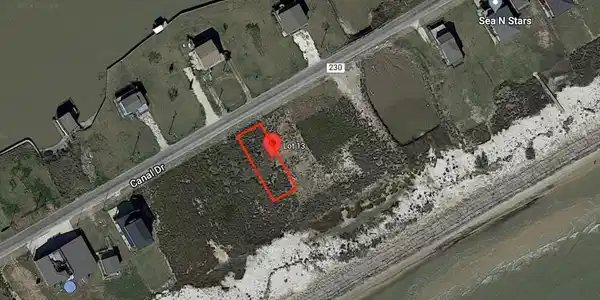 Image 2: 1064 Canal Dr. CR 230, is a 50'x160' vacant lot wi