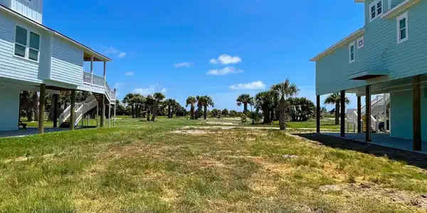 Image 4: This photo shows a coastal property with elevated