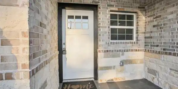 Image 2: Multi panel front door with brick surround front p