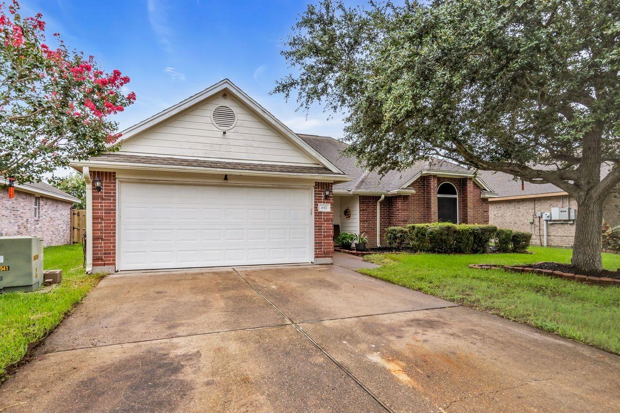 Image 2: Double driveway with 2 car garage.
