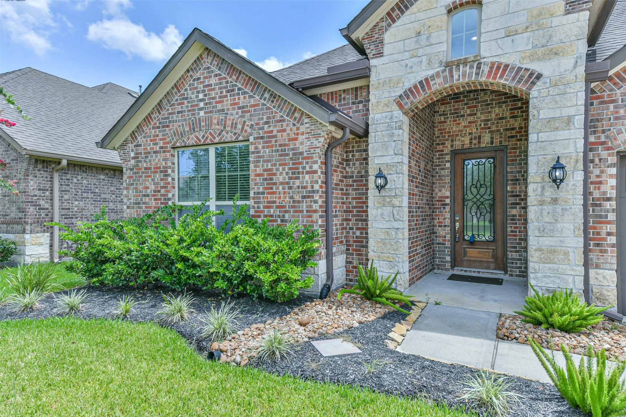 Image 3: Welcoming covered entry with charming curb appeal